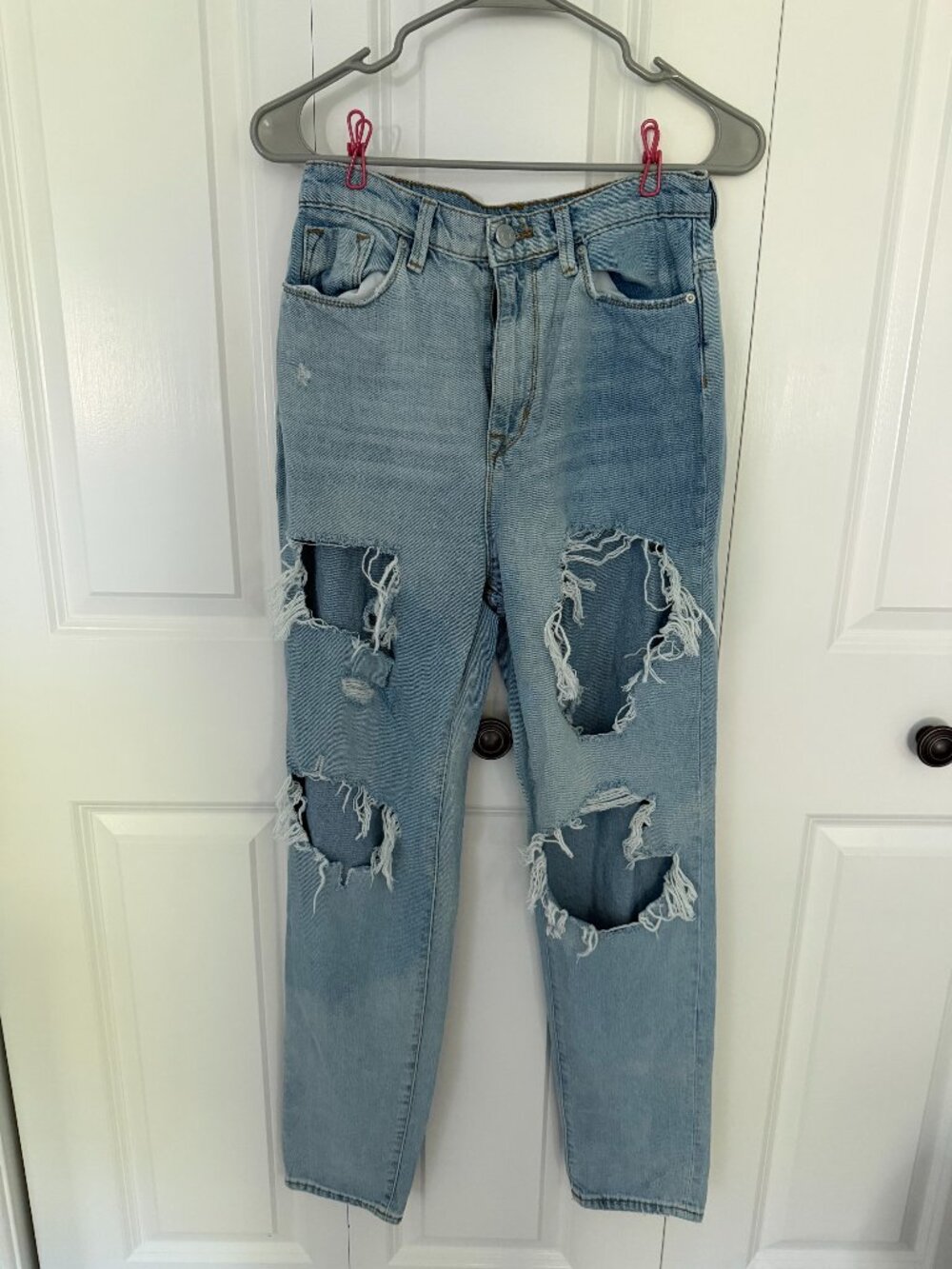 BDG high-rise mom jeans in a light wash with heavy distressing - Size 4
